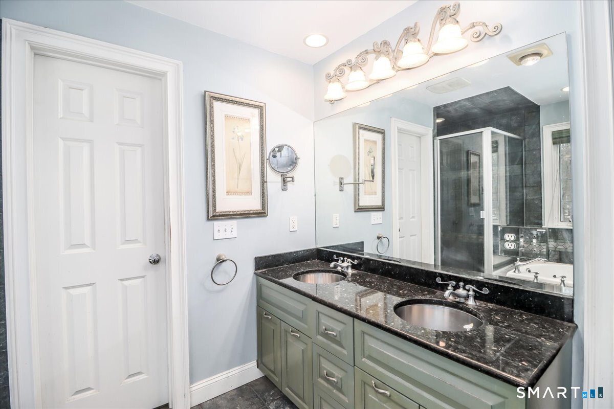 80 Maple Road Easton, CT 06612 - Photo 33 of 37 a bathroom with a granite countertop sink and a mirror