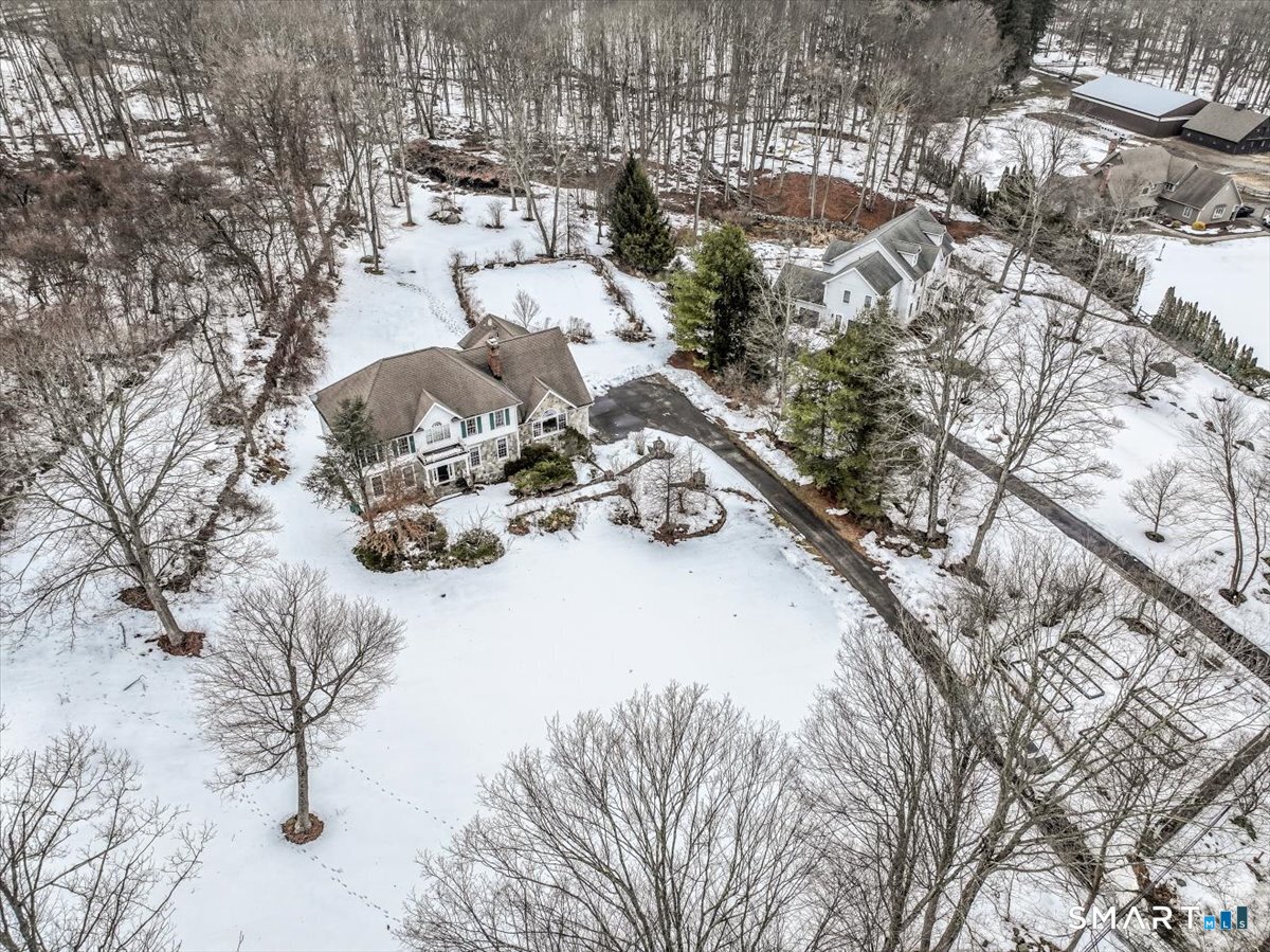 80 Maple Road Easton, CT 06612 - Photo 6 of 37 a view of a snow in the middle of a yard