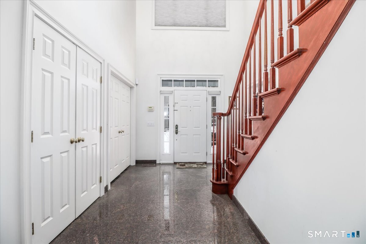 80 Maple Road Easton, CT 06612 - Photo 7 of 37 a view of an entryway with wooden floor