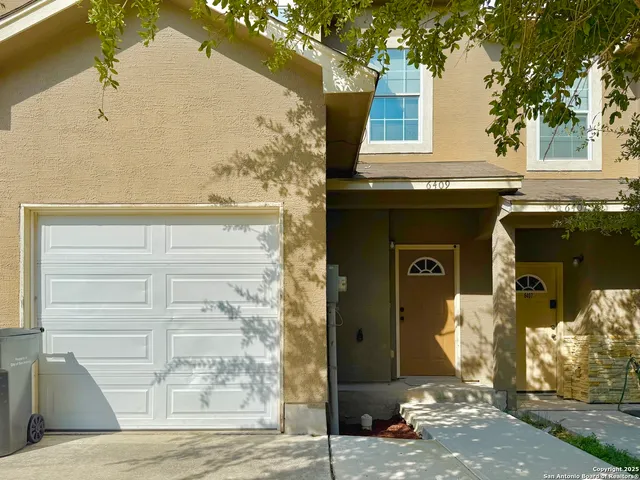 a front view of a house with parking