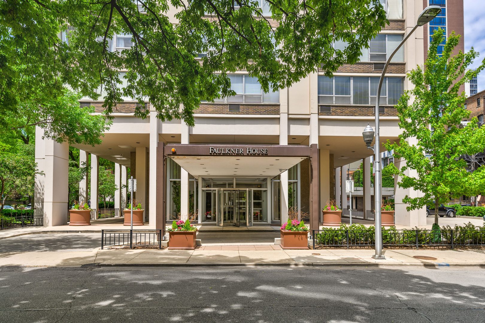 70 West Burton Place, Unit 705 Chicago, IL 60610 - Photo 2 of 17 a building exterior with large trees