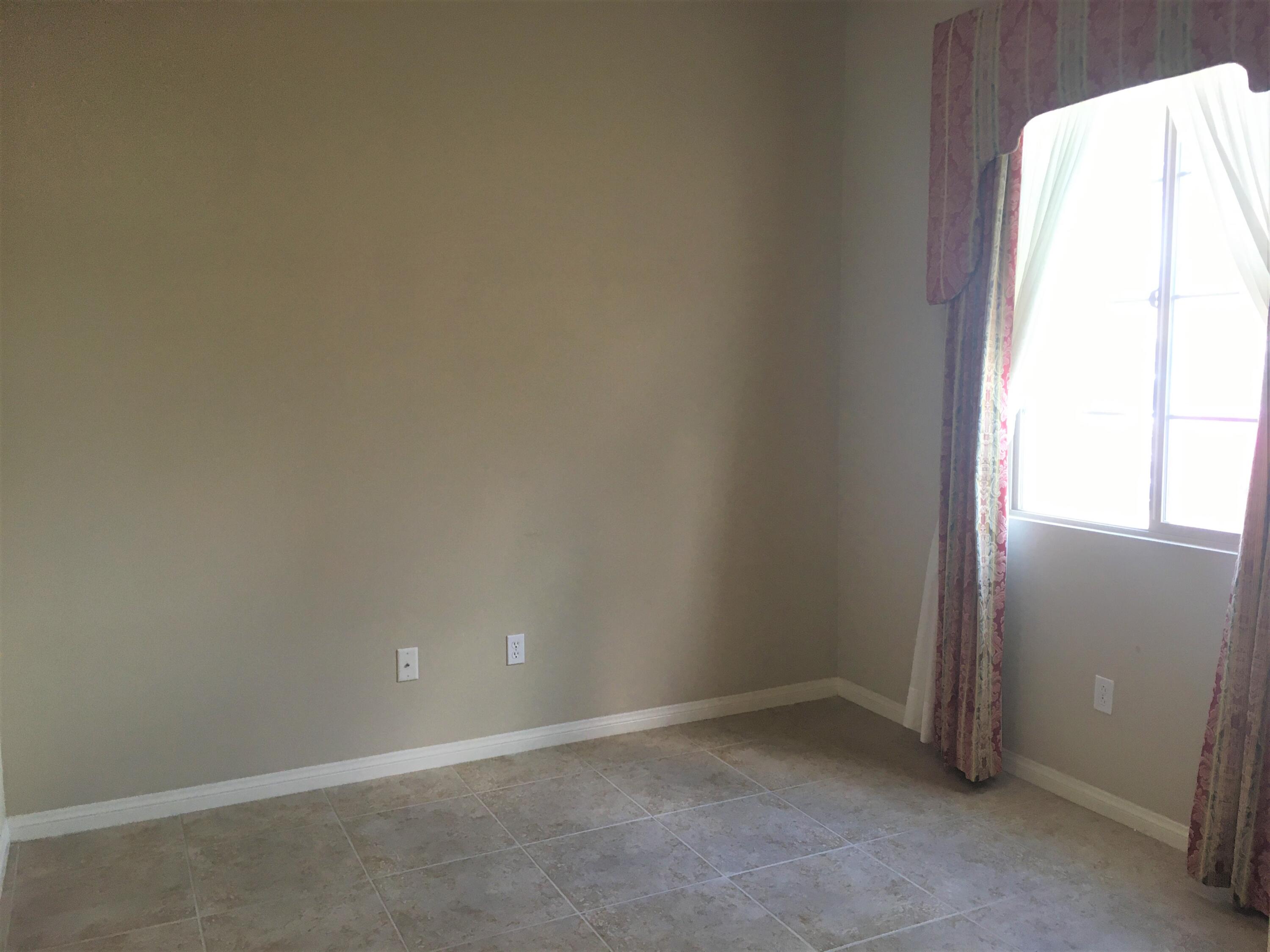 39929 Corte De Moda Indio, CA 92203 - Photo 17 of 46 an empty room with a window