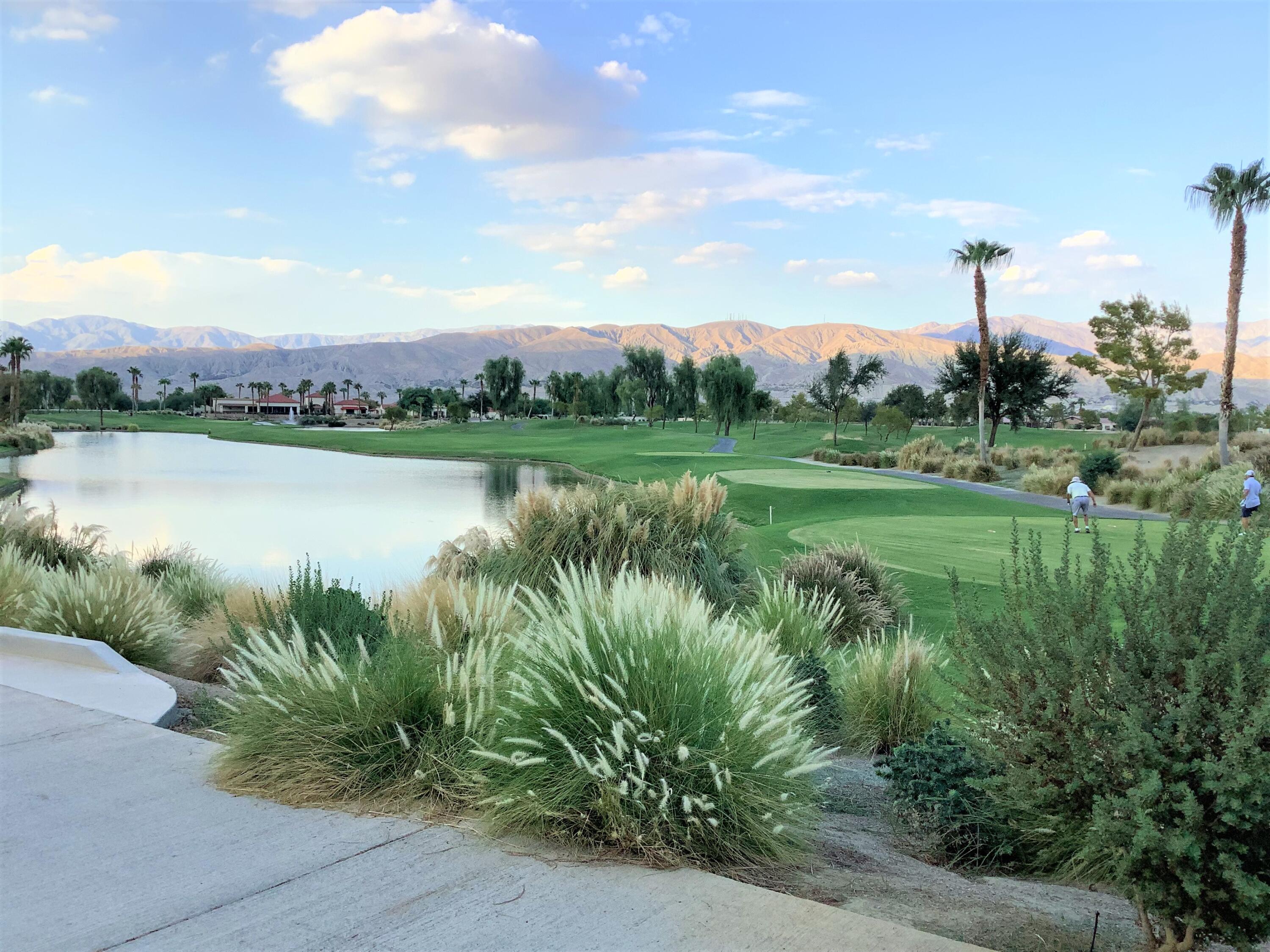 39929 Corte De Moda Indio, CA 92203 - Photo 22 of 46 a view of a lake with a big yard and palm trees
