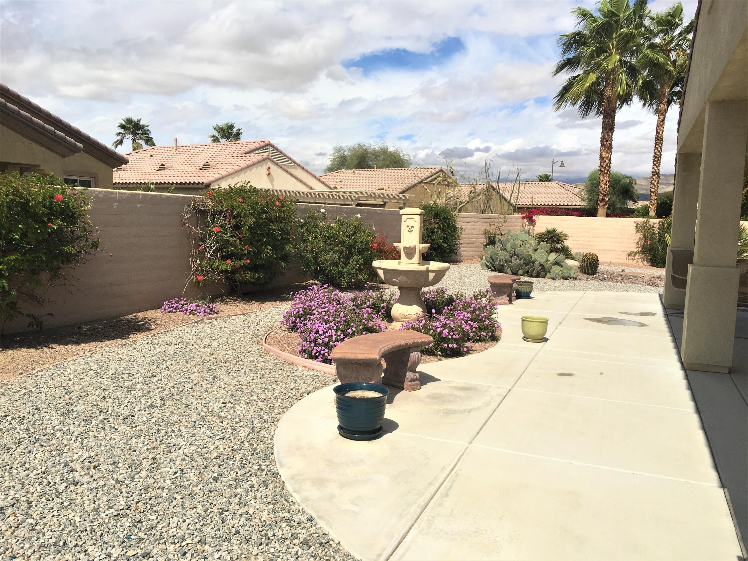 39929 Corte De Moda Indio, CA 92203 - Photo 7 of 46 a view of a swimming pool with potted plants
