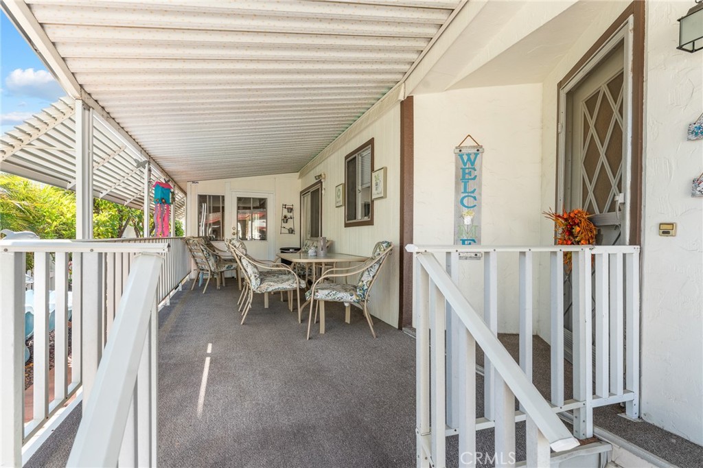 35218 Fir Avenue, Unit 183 Yucaipa, CA 92399 - Photo 2 of 35 a view of a porch with chairs