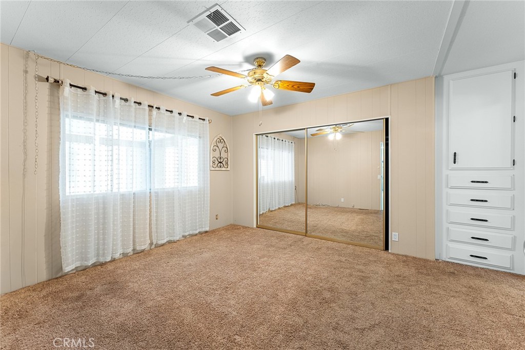 35218 Fir Avenue, Unit 183 Yucaipa, CA 92399 - Photo 21 of 35 a view of an empty room with a window