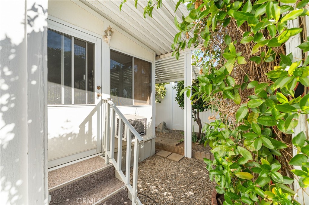 35218 Fir Avenue, Unit 183 Yucaipa, CA 92399 - Photo 29 of 35 a view of a balcony with chair and table