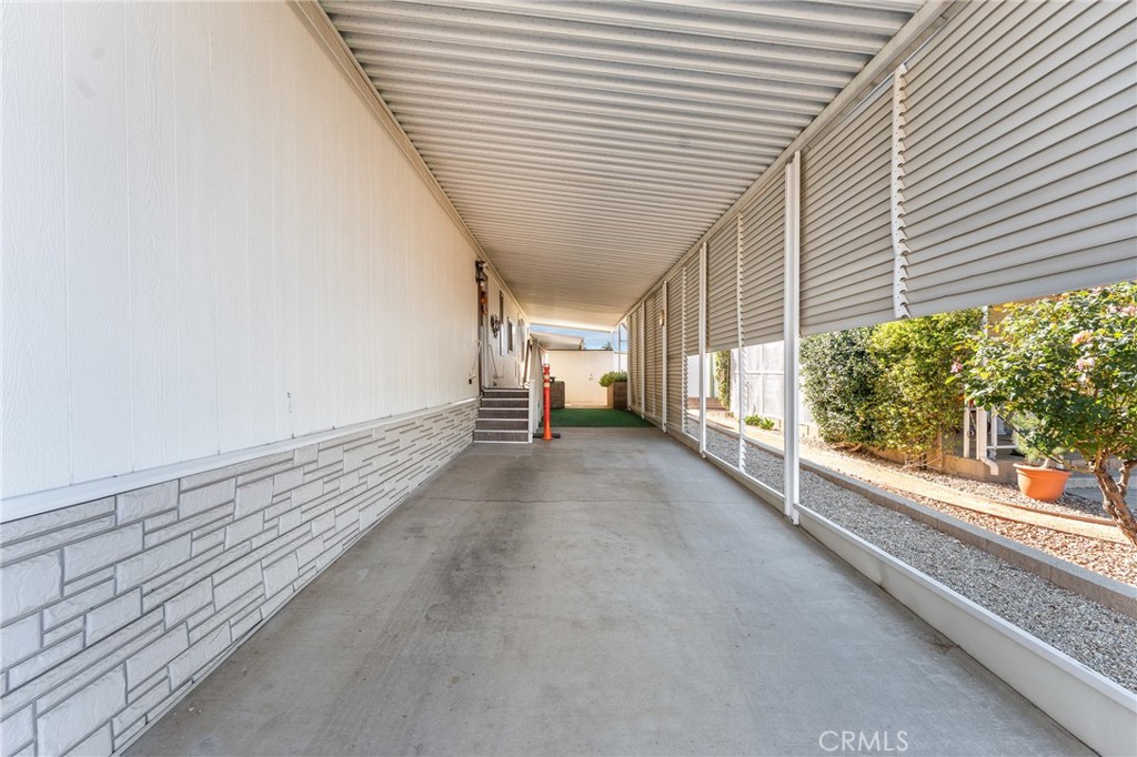 35218 Fir Avenue, Unit 183 Yucaipa, CA 92399 - Photo 30 of 35 a view of a porch with wooden floor