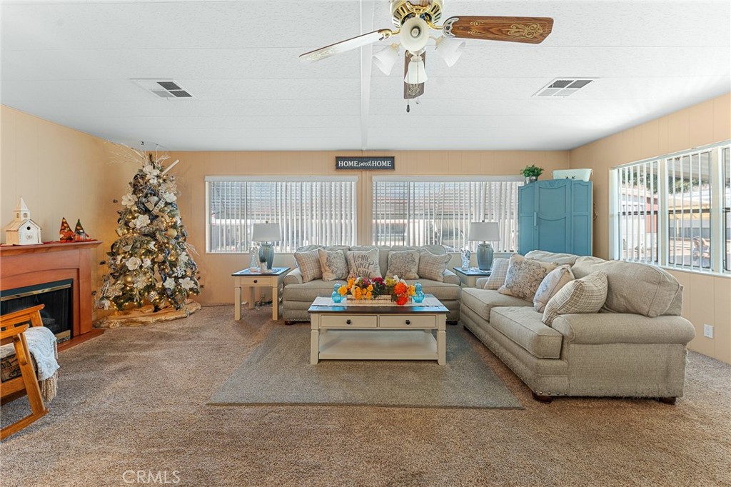 35218 Fir Avenue, Unit 183 Yucaipa, CA 92399 - Photo 7 of 35 a living room with furniture and a large window