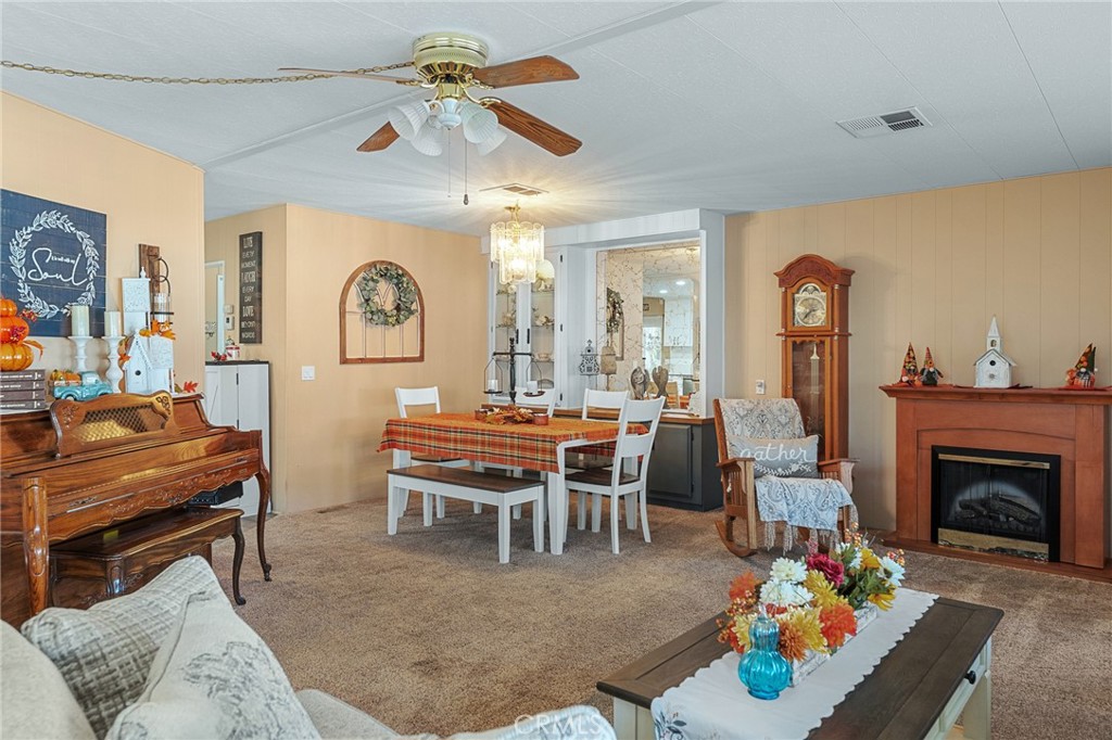 35218 Fir Avenue, Unit 183 Yucaipa, CA 92399 - Photo 10 of 35 a living room with furniture and a fireplace
