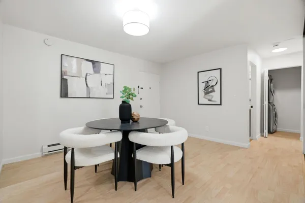 a dining room with furniture and window
