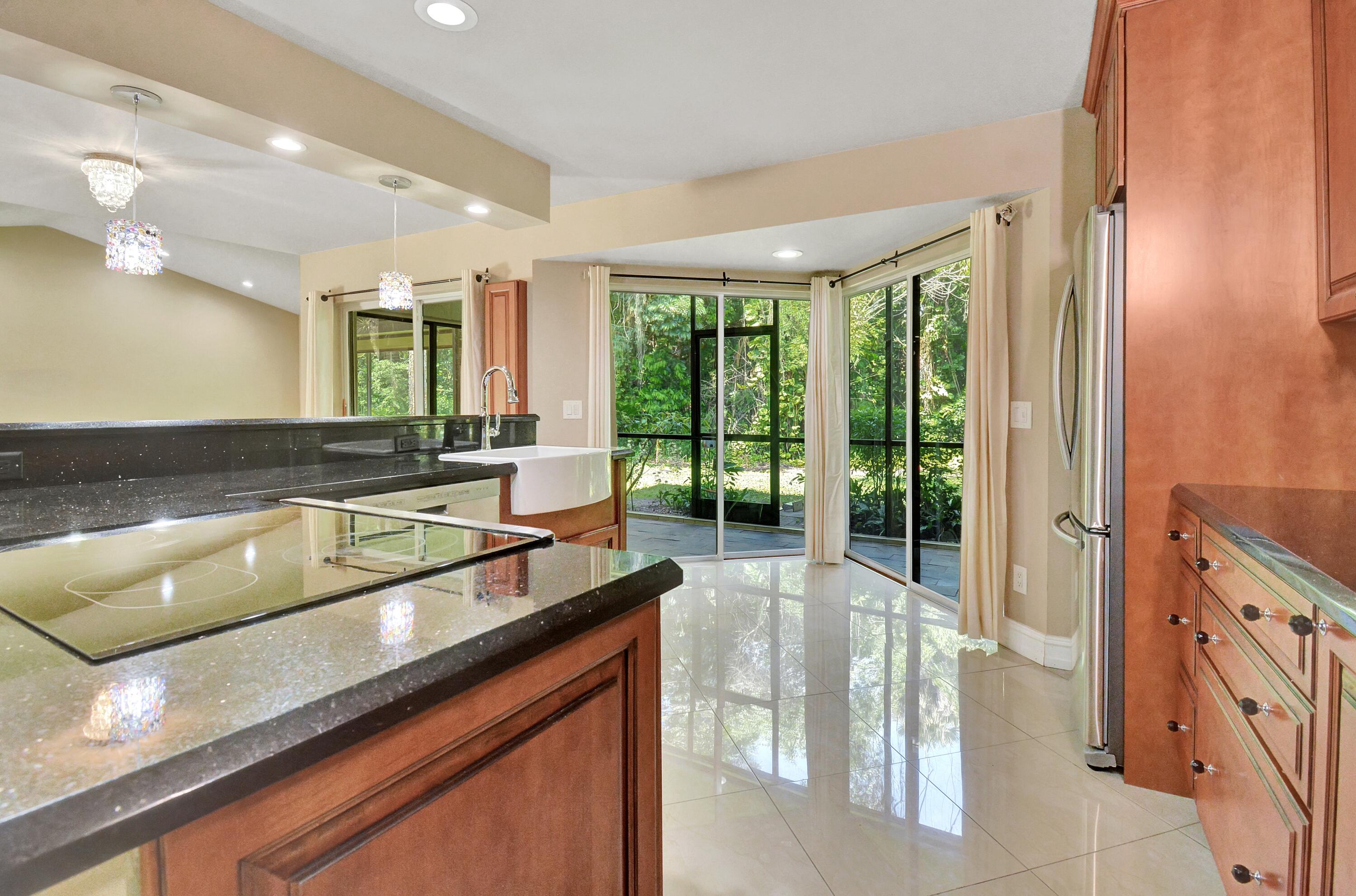 5590 Coach House Circle, Unit A Boca Raton, FL 33486 - Photo 11 of 33 a lobby with furniture and large windows