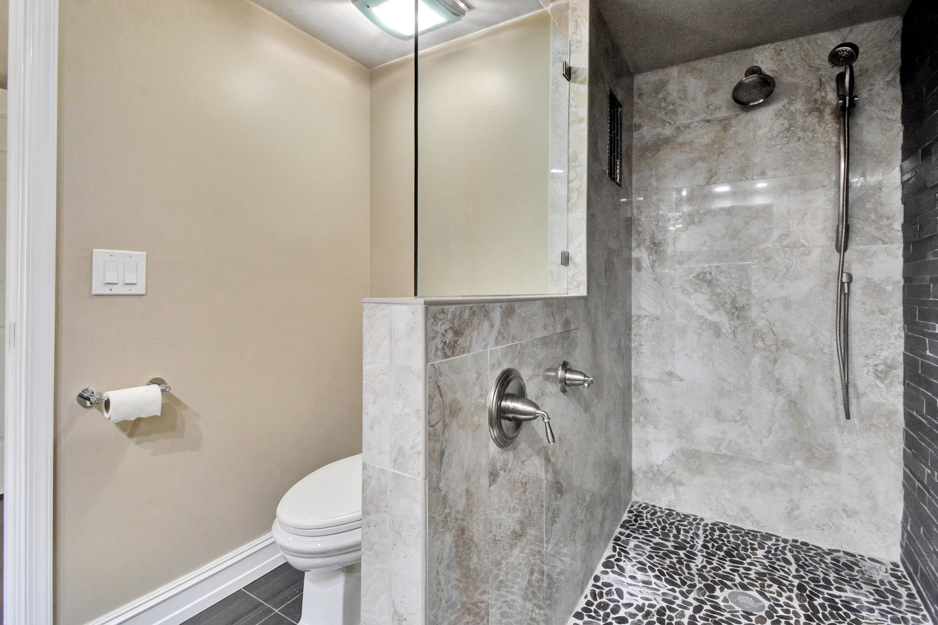 5590 Coach House Circle, Unit A Boca Raton, FL 33486 - Photo 22 of 33 a bathroom with a shower and a toilet