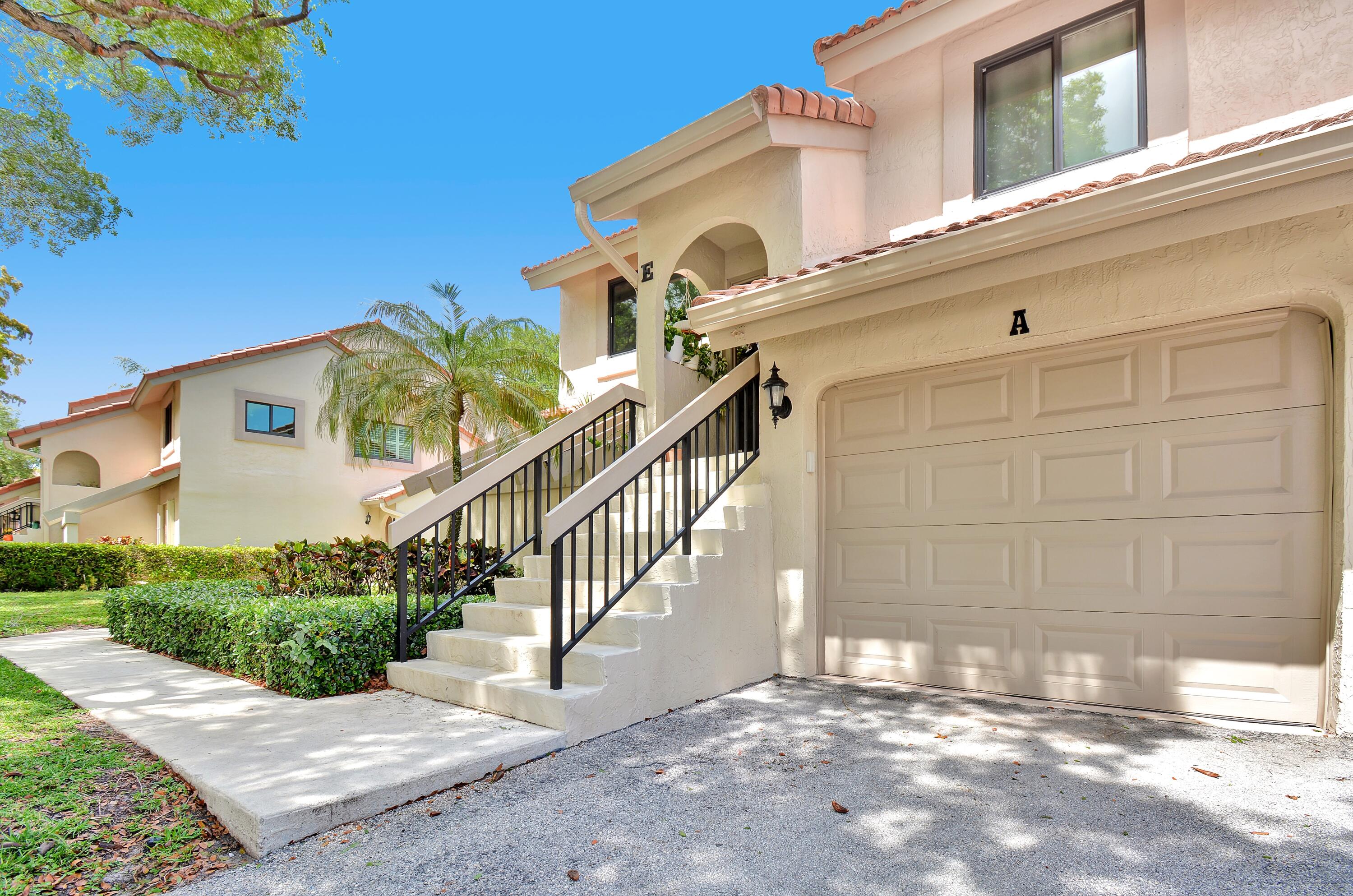 5590 Coach House Circle, Unit A Boca Raton, FL 33486 - Photo 3 of 33 a view of a house with a street