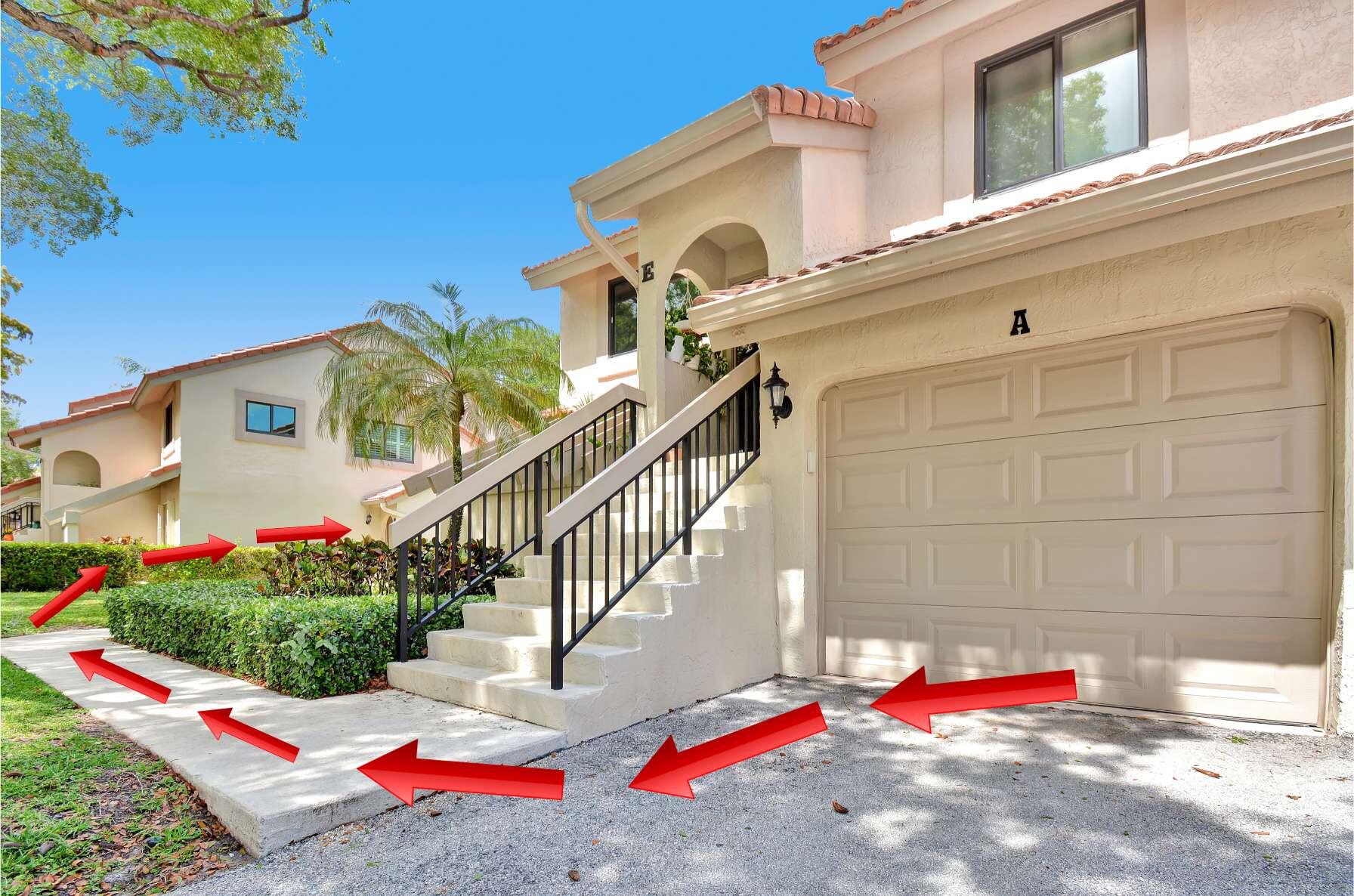 5590 Coach House Circle, Unit A Boca Raton, FL 33486 - Photo 4 of 33 a view of entryway with flower pots