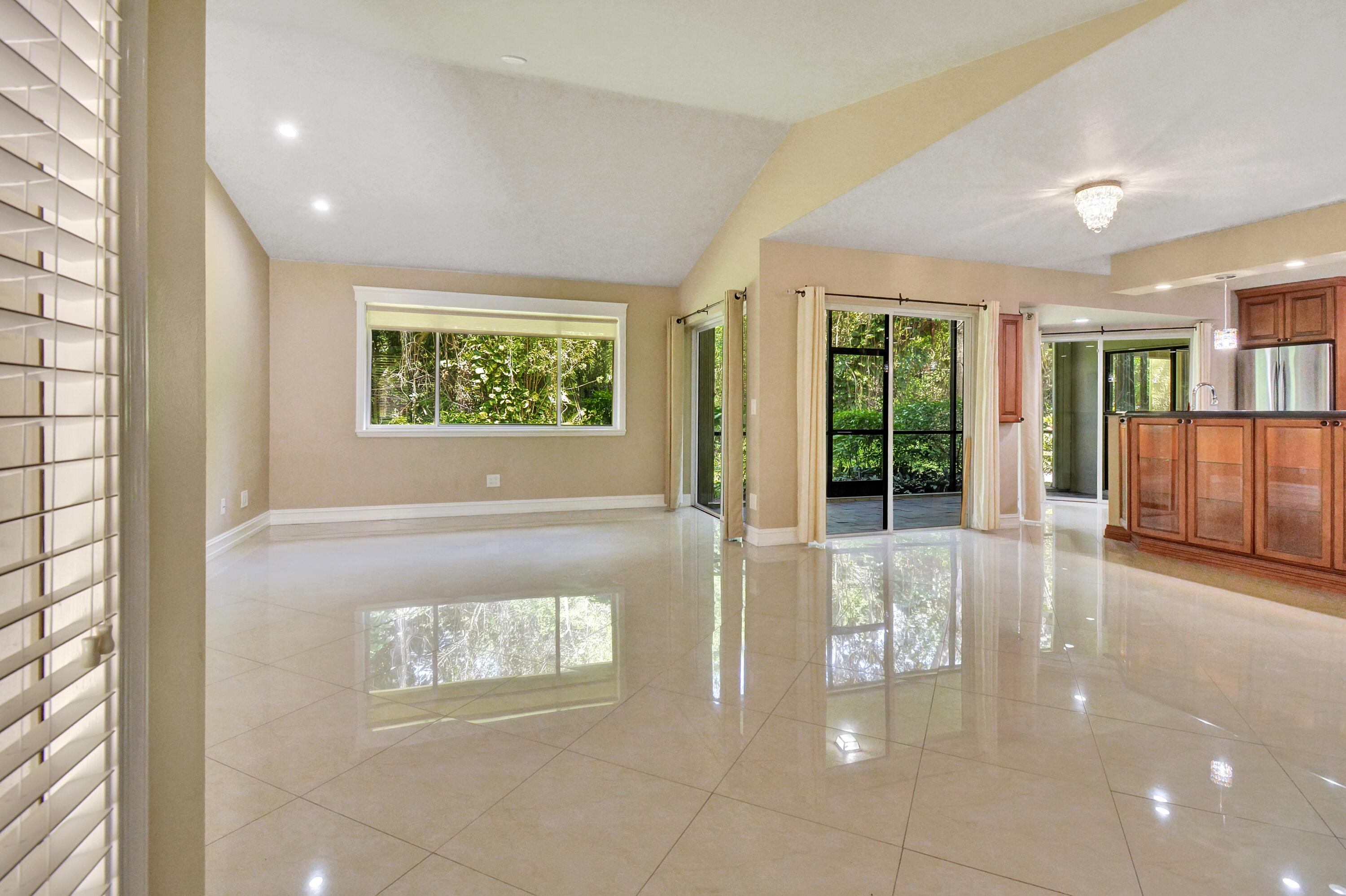 5590 Coach House Circle, Unit A Boca Raton, FL 33486 - Photo 6 of 33 a view of an entryway of a house and window