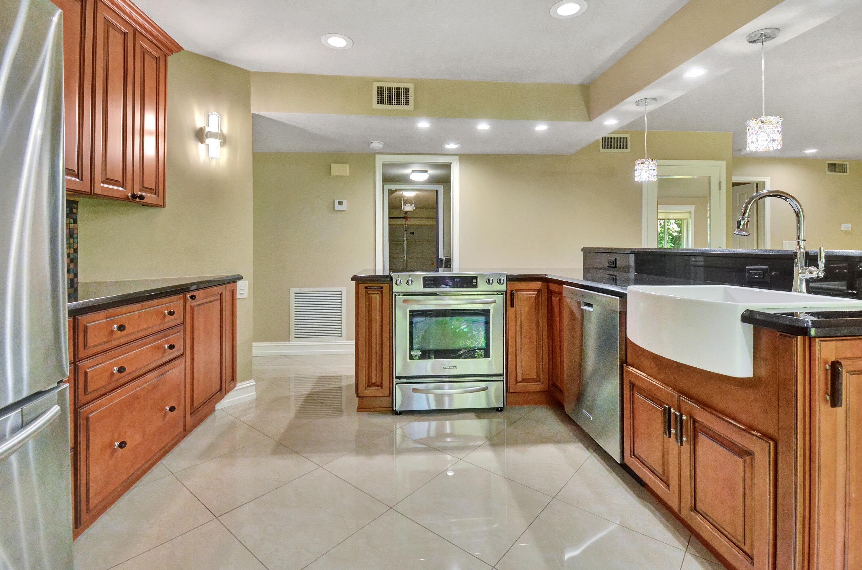 5590 Coach House Circle, Unit A Boca Raton, FL 33486 - Photo 9 of 33 a bathroom with a sink a vanity and a mirror