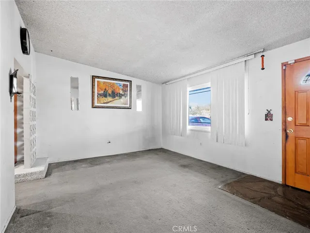 a kitchen with stainless steel appliances granite countertop a stove top oven a sink dishwasher and a microwave oven on the blue kitchen countertops