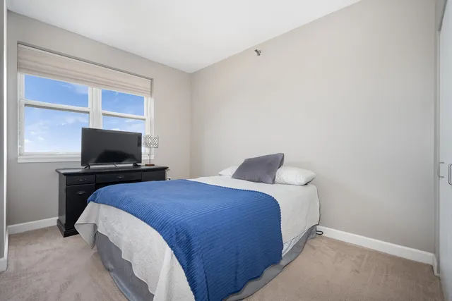 a bathroom with a toilet sink and shower