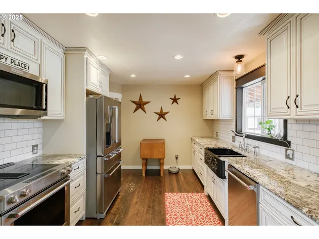 a kitchen with a sink stove and refrigerator