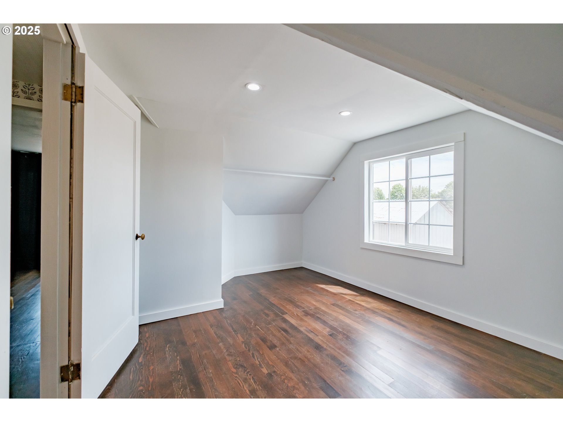 37929 Kelly Road Scio, OR 97374 - Photo 40 of 48 a view of an empty room with wooden floor and a window