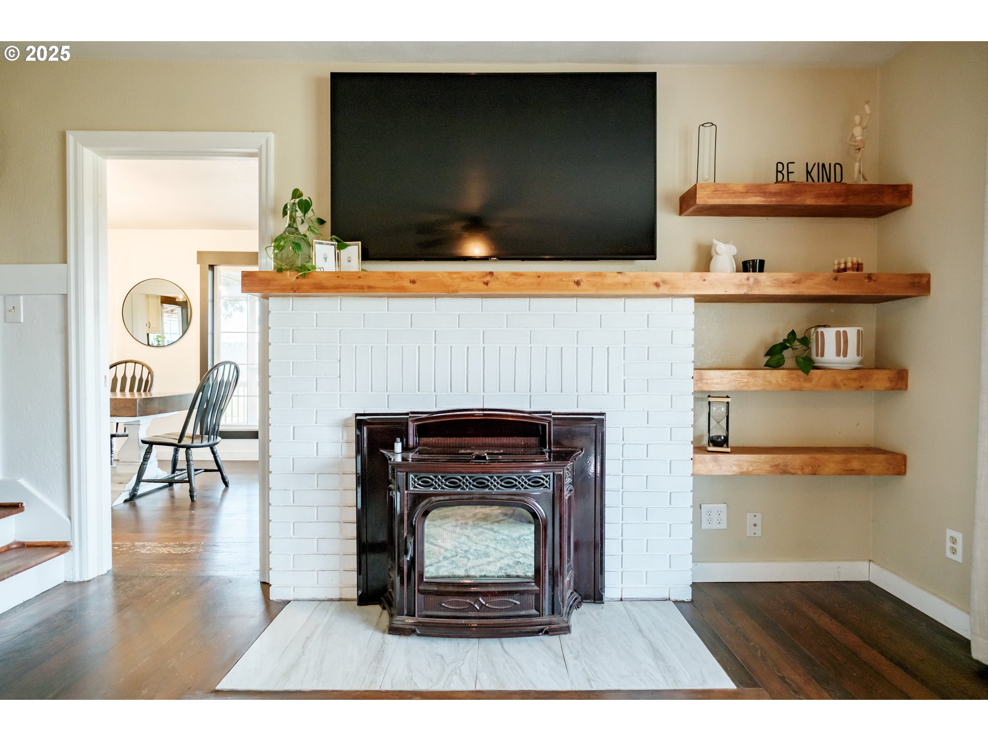 37929 Kelly Road Scio, OR 97374 - Photo 43 of 48 a living room with a wooden floor and a fireplace