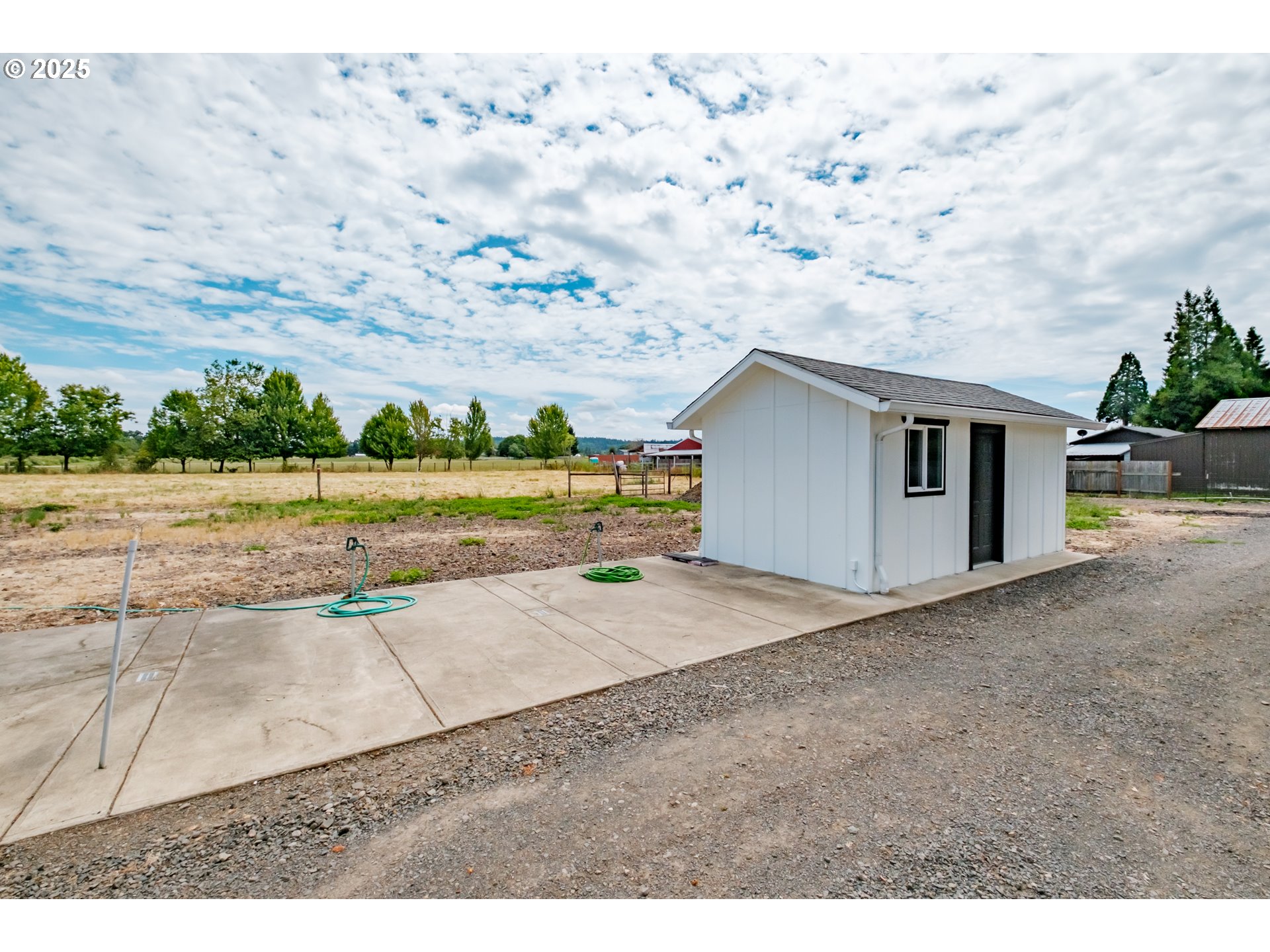 37929 Kelly Road Scio, OR 97374 - Photo 7 of 48 a backyard of a house with a yard and garage