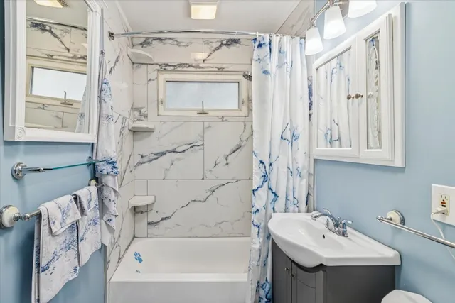 a bathroom with a sink a toilet and a bathtub