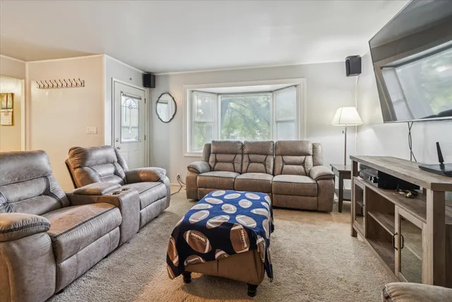a bedroom with furniture and a window