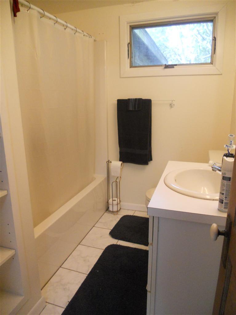 40 Bayview Road Mashpee, MA 02649 - Photo 16 of 23 a bathroom with a sink and a mirror