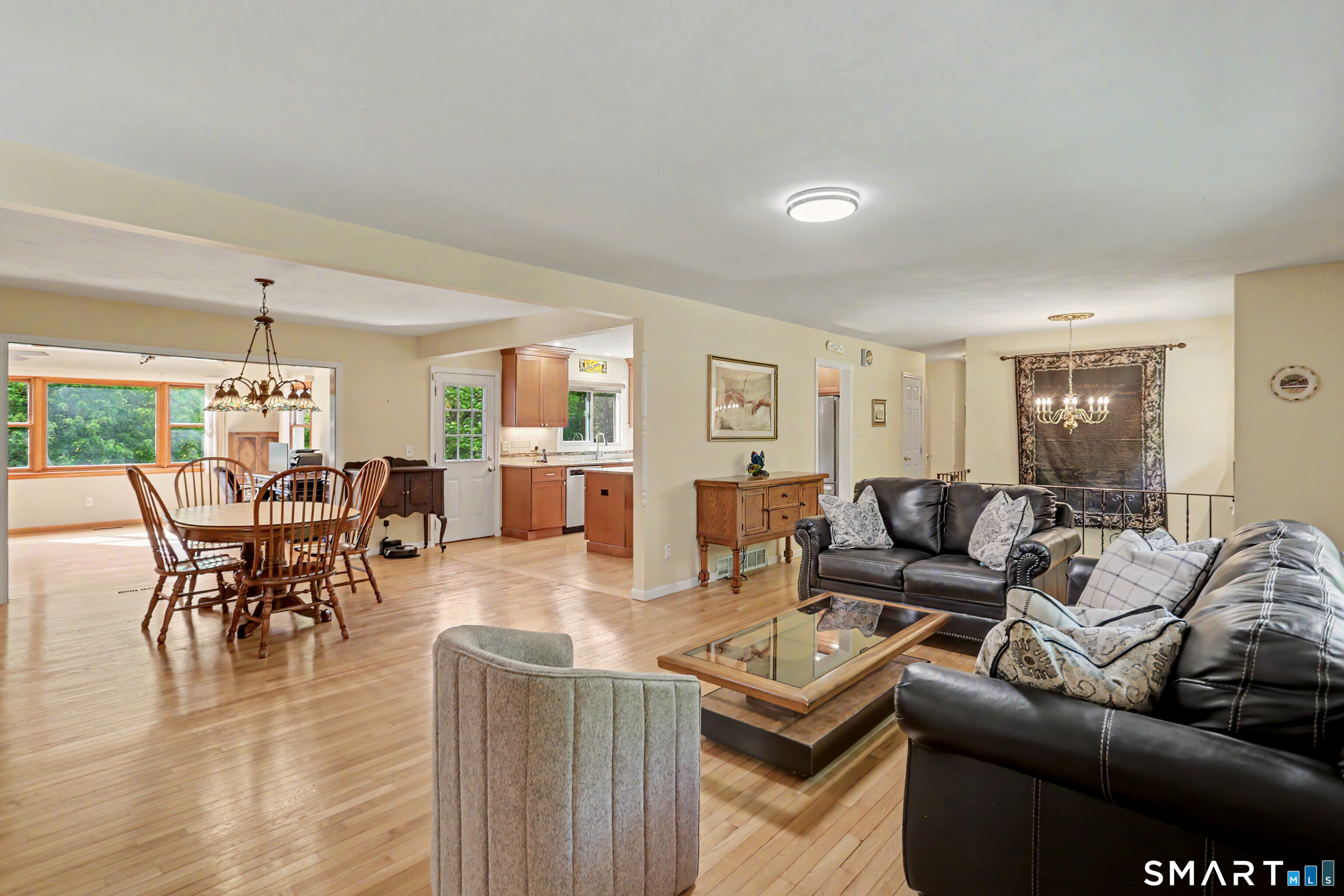 632 Wheelers Farm Road Orange, CT 06477 - Photo 6 of 39 a living room with furniture wooden floor and a window