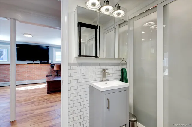 a bathroom with a sink and a mirror