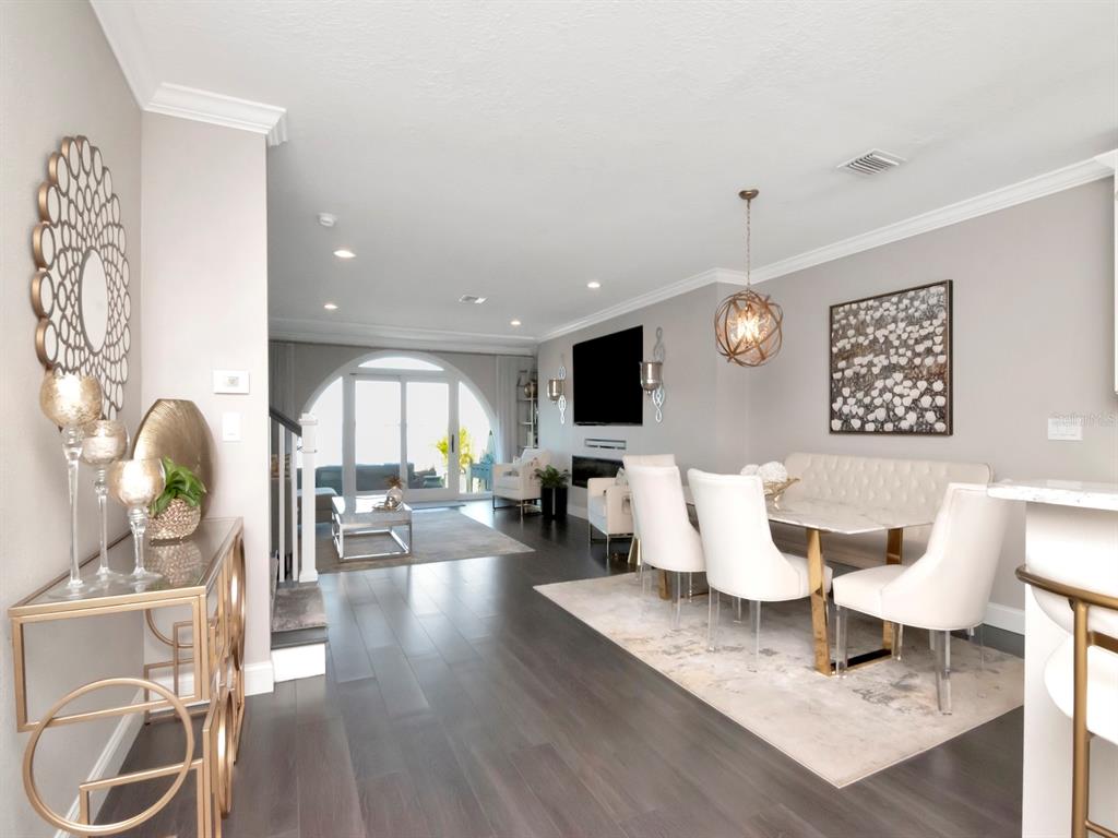 2807 West Hawthorne Road, Unit 11 Tampa, FL 33611 - Photo 14 of 76 a living room with furniture and a flat screen tv