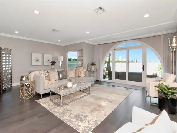 a living room with furniture and a rug