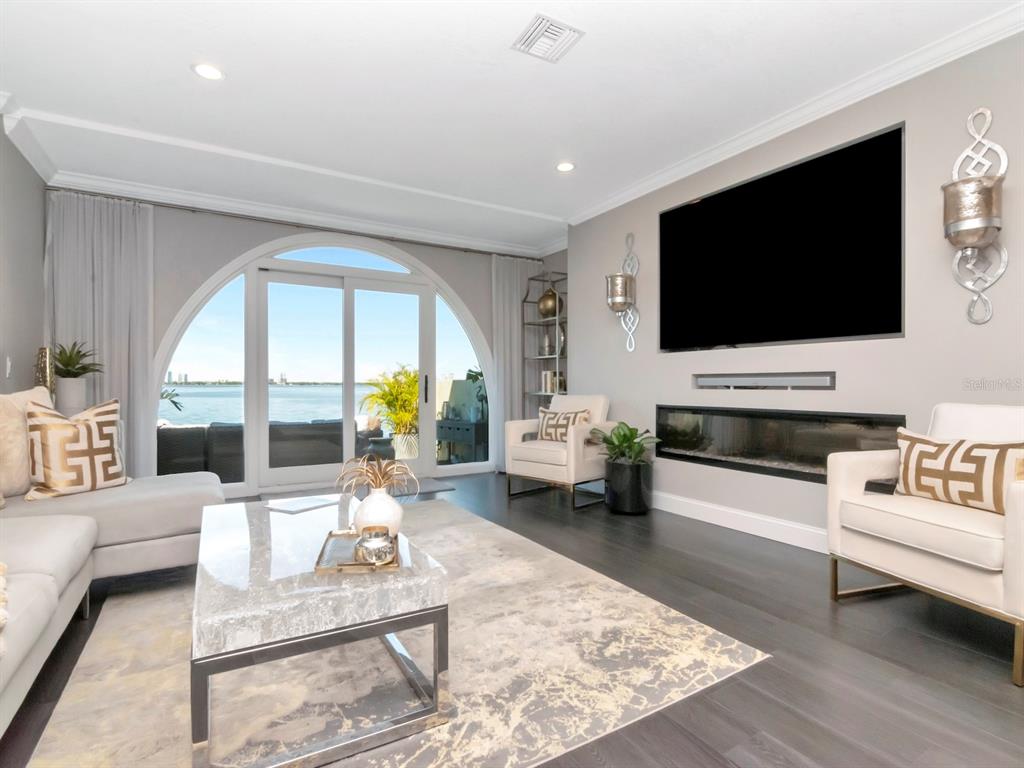 2807 West Hawthorne Road, Unit 11 Tampa, FL 33611 - Photo 19 of 76 a living room with furniture and a flat screen tv