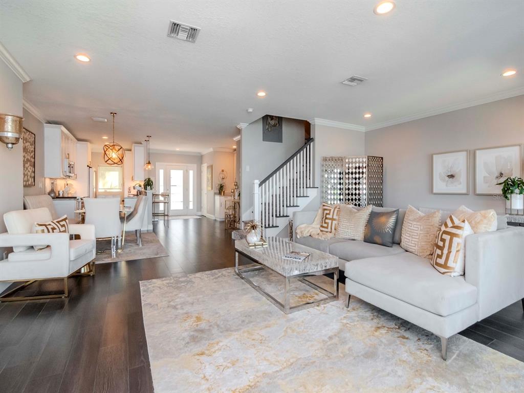 2807 West Hawthorne Road, Unit 11 Tampa, FL 33611 - Photo 22 of 76 a living room with furniture and a wooden floor
