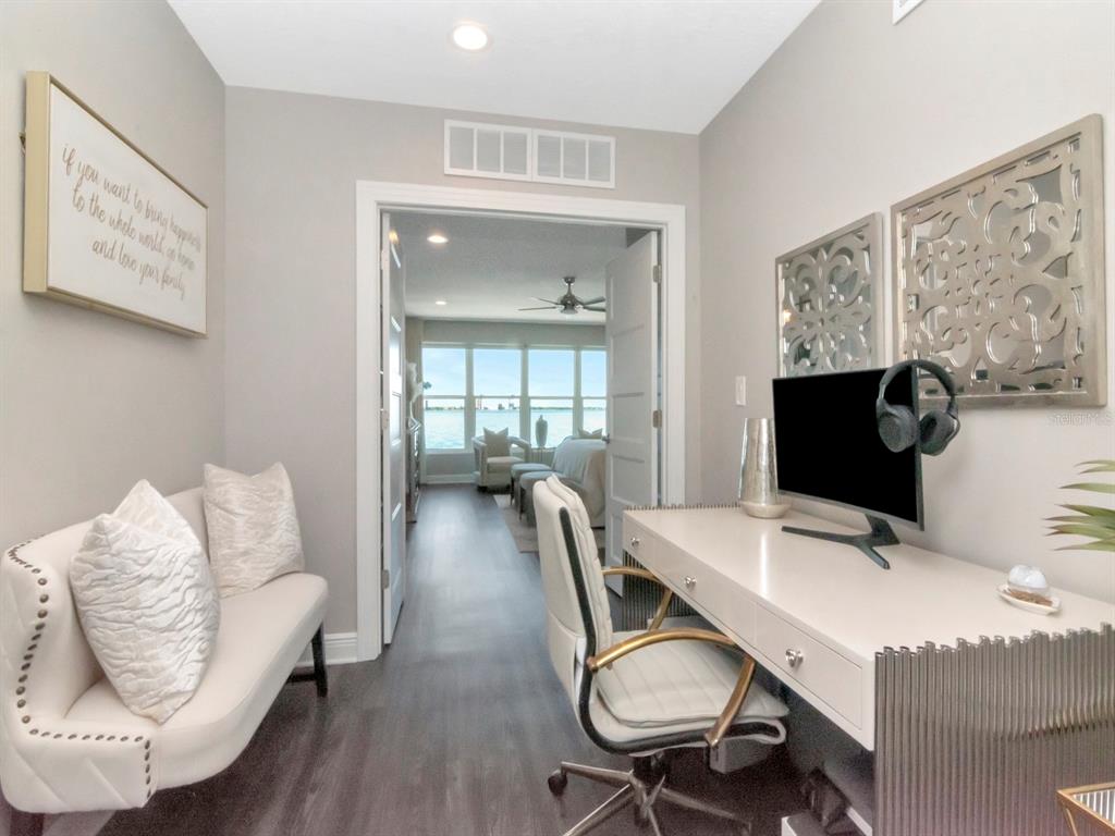 2807 West Hawthorne Road, Unit 11 Tampa, FL 33611 - Photo 24 of 76 a view of a dining room with furniture and wooden floor