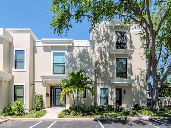 a kitchen with stainless steel appliances a stove a microwave and cabinets