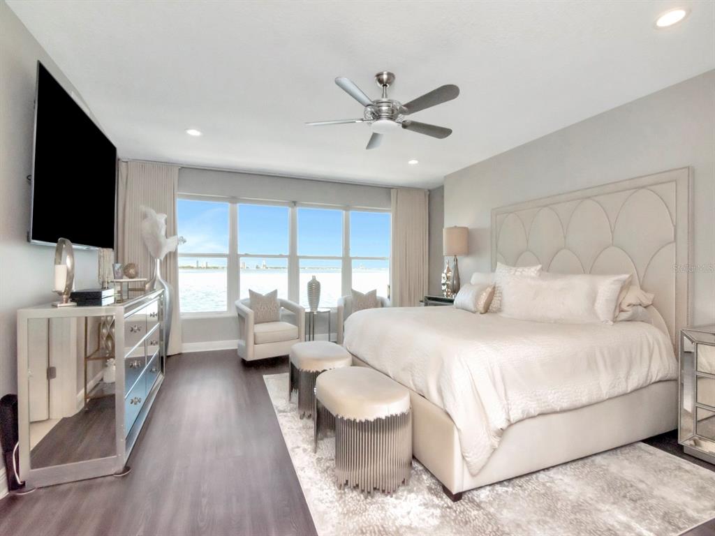 2807 West Hawthorne Road, Unit 11 Tampa, FL 33611 - Photo 31 of 76 a bedroom with a large bed and a flat screen tv