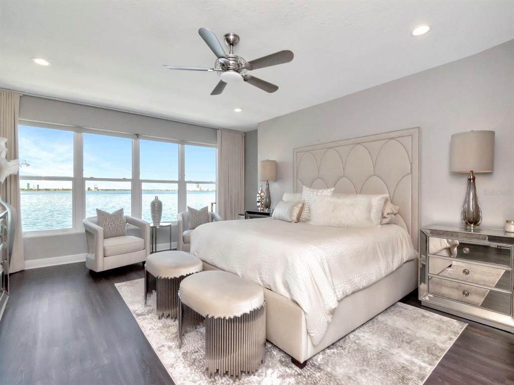 2807 West Hawthorne Road, Unit 11 Tampa, FL 33611 - Photo 32 of 76 a bedroom with a bed and a large window