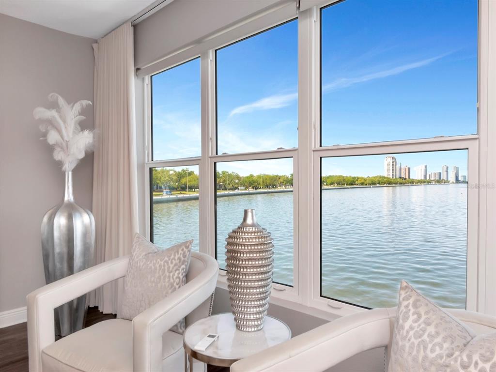 2807 West Hawthorne Road, Unit 11 Tampa, FL 33611 - Photo 34 of 76 a view of dining room with furniture and wooden floor