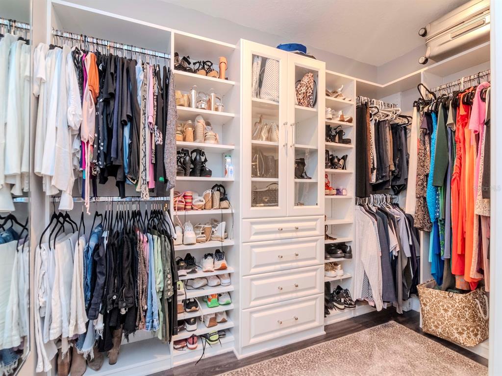 2807 West Hawthorne Road, Unit 11 Tampa, FL 33611 - Photo 35 of 76 a view of walk in closet with clothes and shoes