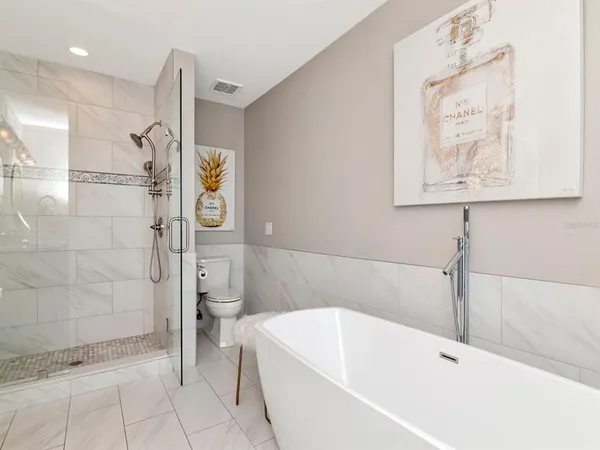 an aerial view of a house with a lake view