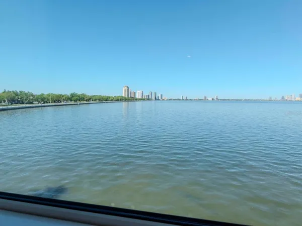 a view of a terrace with couches and ocean view