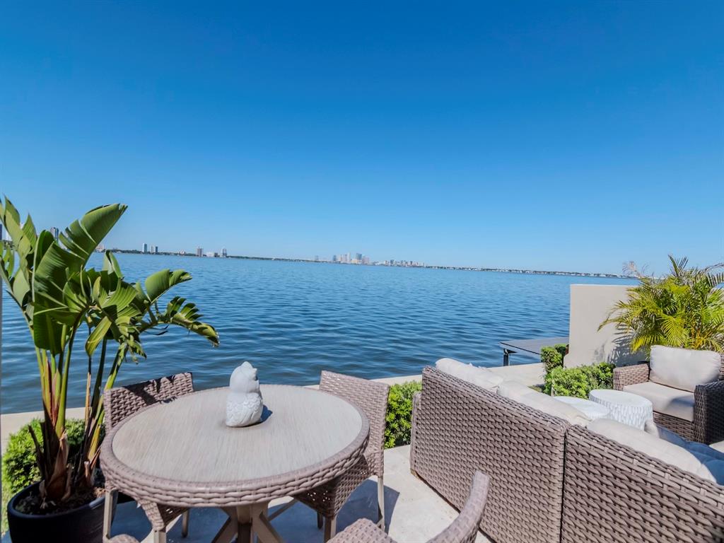 2807 West Hawthorne Road, Unit 11 Tampa, FL 33611 - Photo 47 of 76 a view of a terrace with chair and potted plants