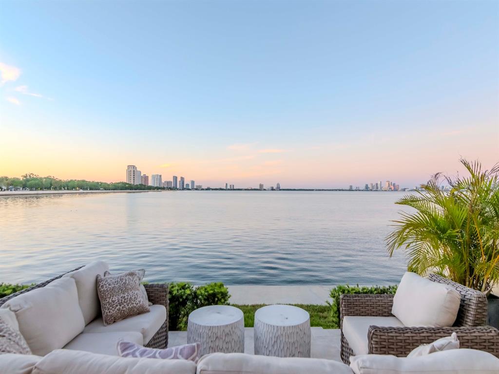 2807 West Hawthorne Road, Unit 11 Tampa, FL 33611 - Photo 58 of 76 a view of a terrace with couches and wooden floor