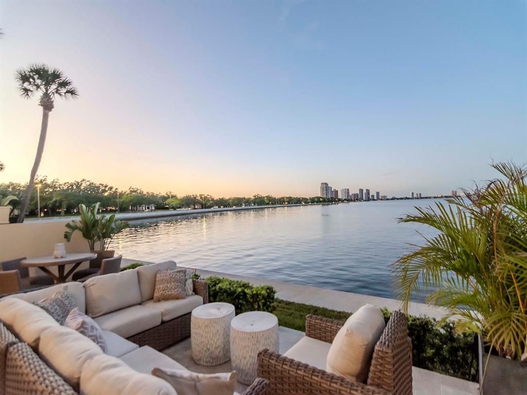 2807 West Hawthorne Road, Unit 11 Tampa, FL 33611 - Photo 67 of 76 a view of a patio with couches chairs and a table
