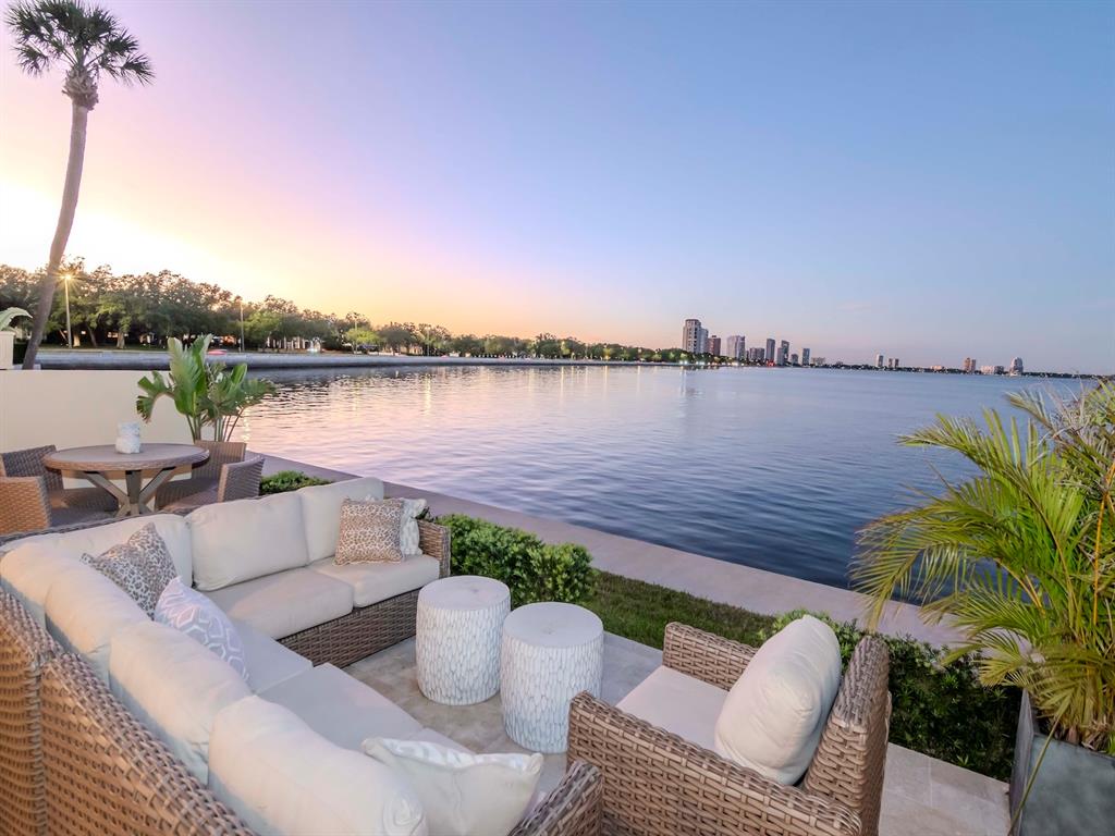 2807 West Hawthorne Road, Unit 11 Tampa, FL 33611 - Photo 70 of 76 a view of a lake with couches and wooden floor
