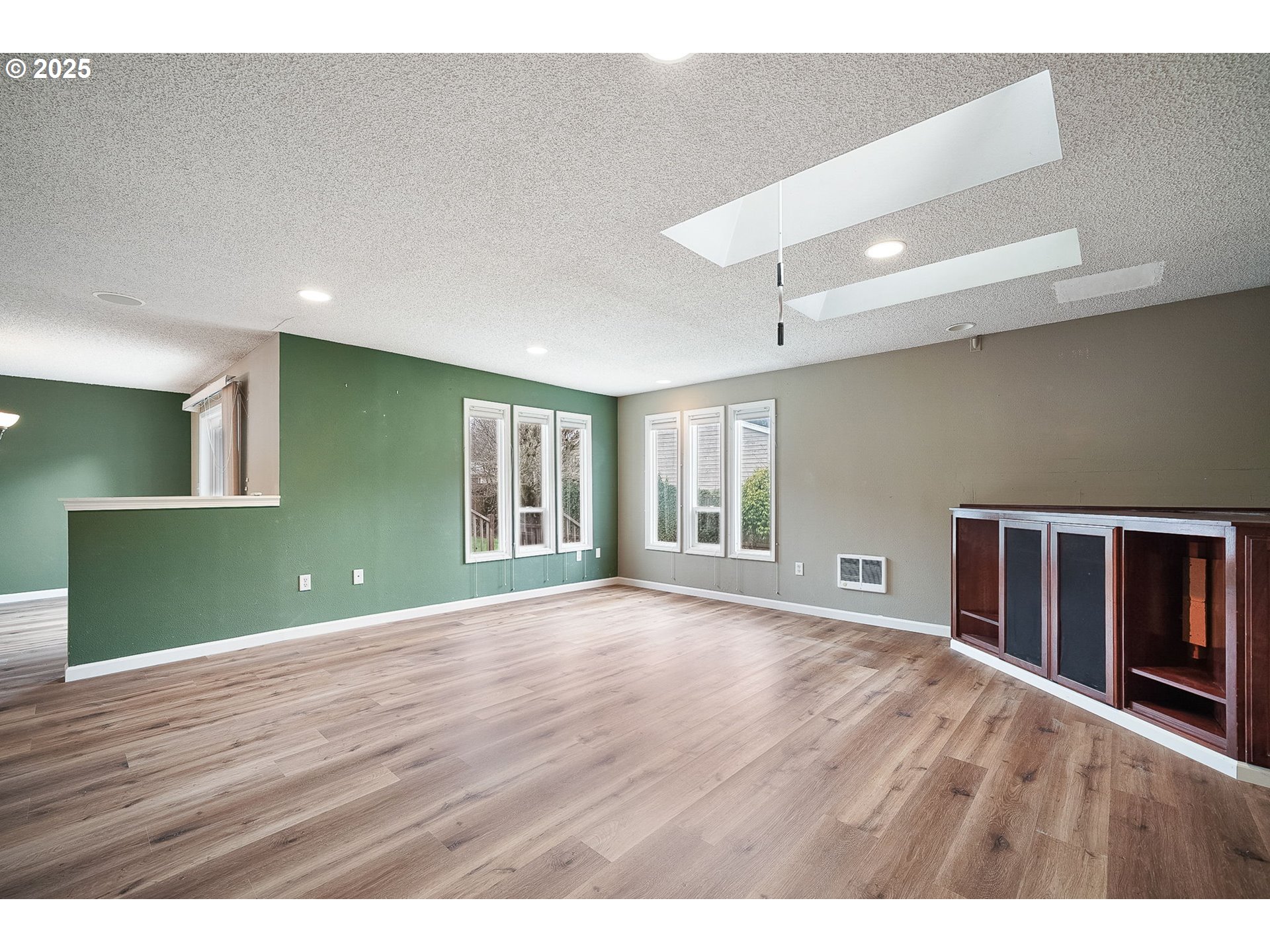 550 Evergreen Loop Reedsport, OR 97467 - Photo 15 of 35 a view of an empty room with wooden floor and a window