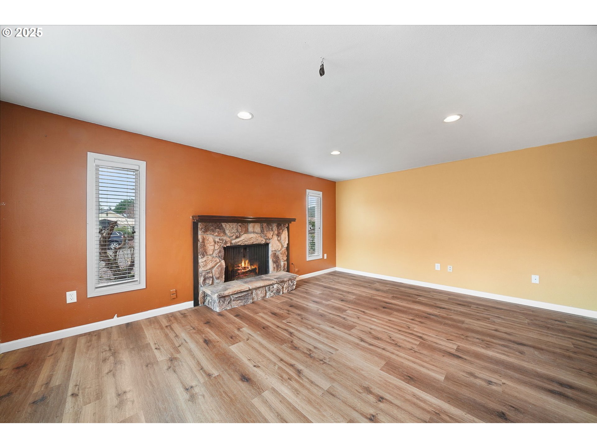 550 Evergreen Loop Reedsport, OR 97467 - Photo 19 of 35 a view of an empty room with a fireplace and a window